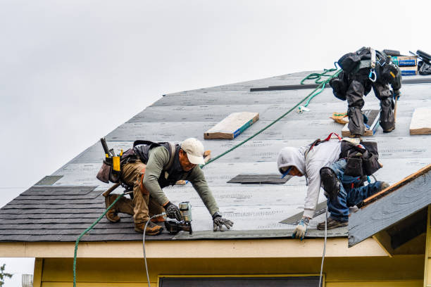 Professional Gutter Installation technician working in Old Station, CA